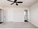 Spacious bedroom features neutral tones, carpet flooring, and a modern ceiling fan at 5840 Longs Peak St, Brighton, CO 80601