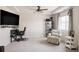 Large bonus room with tray ceilings, ceiling fan and lots of natural light at 5840 Longs Peak St, Brighton, CO 80601