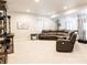 Cozy living room with comfortable seating, recessed lighting, and stylish decor at 5840 Longs Peak St, Brighton, CO 80601