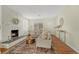 Bright living room featuring a fireplace, hardwood floors, and neutral decor at 1059 Racine St, Aurora, CO 80011