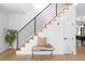 Bright entryway with hardwood floors, black railing and a wooden staircase at 4362 Peach Ct, Boulder, CO 80301