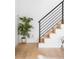 Entryway with a black railing and wooden staircase with a hardwood floor at 4362 Peach Ct, Boulder, CO 80301