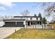 Beautiful two-story home with a three-car garage and landscaped front yard at 4362 Peach Ct, Boulder, CO 80301