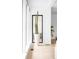 Bright hallway with natural light, hardwood flooring, and a tall cactus in a stylish white pot at 4362 Peach Ct, Boulder, CO 80301