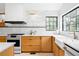 Bright kitchen featuring modern appliances, a white subway tile backsplash, and wood cabinetry at 4362 Peach Ct, Boulder, CO 80301