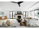 A living room with hardwood floors, white walls, a ceiling fan and couches at 4362 Peach Ct, Boulder, CO 80301