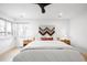 Inviting main bedroom with minimalist décor, natural wood nightstands, and a cozy bedspread at 4362 Peach Ct, Boulder, CO 80301