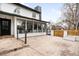 A stone patio behind a house with a sliding glass door at 4362 Peach Ct, Boulder, CO 80301