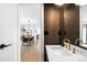 Stylish powder room featuring a marble countertop, gold faucet, and elegant decor at 4362 Peach Ct, Boulder, CO 80301