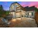 Charming backyard patio with comfortable seating, a grill, and serene ambiance at 1033 Estes St, Lakewood, CO 80215