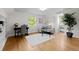 Cozy room offers hardwood floors, a desk, sofa and ample natural light from the window at 1033 Estes St, Lakewood, CO 80215