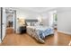 Cozy bedroom with a plush bed, neutral decor, and bedside tables with lamps at 1033 Estes St, Lakewood, CO 80215