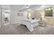 Basement bedroom with neutral carpet, white walls, and a comfortable bed setup at 1033 Estes St, Lakewood, CO 80215