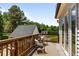 Wooden deck provides a peaceful outdoor space with views of the backyard and surrounding greenery at 1033 Estes St, Lakewood, CO 80215