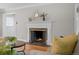 Classic brick fireplace in a cozy living room, adding warmth and charm to the space at 1033 Estes St, Lakewood, CO 80215