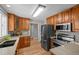 Updated kitchen boasts stainless steel appliances, light countertops, and plenty of cabinet space at 1033 Estes St, Lakewood, CO 80215