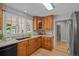 Updated kitchen with stainless steel sink overlooking the backyard at 1033 Estes St, Lakewood, CO 80215