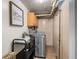 Functional laundry room with modern washer and dryer, and storage cabinets at 1033 Estes St, Lakewood, CO 80215