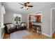 Comfortable living room with hardwood floors and a breakfast bar to the kitchen at 1033 Estes St, Lakewood, CO 80215