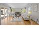 Bright living room with hardwood floors, fireplace, and plenty of natural light at 1033 Estes St, Lakewood, CO 80215