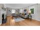 Bright living room with hardwood floors, a fireplace, neutral decor, and abundant natural light at 1033 Estes St, Lakewood, CO 80215