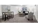 Comfortable living room features stylish seating and a decorative table and chairs at 1033 Estes St, Lakewood, CO 80215