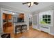 Bright living room with hardwood floors and view into the updated kitchen at 1033 Estes St, Lakewood, CO 80215