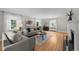 Spacious living room featuring hardwood floors, ample seating, and large windows for natural light at 1033 Estes St, Lakewood, CO 80215