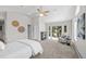 Spacious bedroom with a fireplace and deck access, carpeted floors and neutral walls at 1033 Estes St, Lakewood, CO 80215