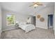 Relaxing bedroom features vaulted ceilings, plush carpet, and generous natural light at 1033 Estes St, Lakewood, CO 80215