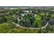 Aerial view of community amenities including a pond, pool and clubhouse at 6430 Silver Mesa Dr # D, Highlands Ranch, CO 80130