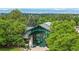 Unique building with green glass exterior and surrounded by lots of lush trees at 6430 Silver Mesa Dr # D, Highlands Ranch, CO 80130