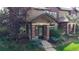 Charming townhome with brick facade and well-maintained landscaping at 6430 Silver Mesa Dr # D, Highlands Ranch, CO 80130