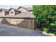 Attached garage with multiple bays, and convenient driveway for easy parking at 6430 Silver Mesa Dr # D, Highlands Ranch, CO 80130