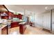 Well-lit kitchen with stainless steel appliances and hardwood floors at 6430 Silver Mesa Dr # D, Highlands Ranch, CO 80130