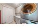 Laundry room featuring a stackable washer and dryer with ample storage space at 6430 Silver Mesa Dr # D, Highlands Ranch, CO 80130