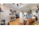 Open living space featuring hardwood floors, fireplace, and comfortable seating at 6430 Silver Mesa Dr # D, Highlands Ranch, CO 80130
