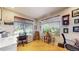 Bright home office with natural light, featuring wood floors, modern desk and windows with views at 6430 Silver Mesa Dr # D, Highlands Ranch, CO 80130