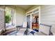 Cozy patio with seating and sliding glass door entry to the dining room at 6430 Silver Mesa Dr # D, Highlands Ranch, CO 80130
