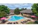 Resort-style pool area with lounge chairs and umbrellas, perfect for relaxing at 6430 Silver Mesa Dr # D, Highlands Ranch, CO 80130