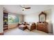 Cozy sitting room with a reading nook, window view and antique dresser at 6430 Silver Mesa Dr # D, Highlands Ranch, CO 80130