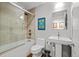 Contemporary bathroom features a glass-enclosed shower/tub combination and modern fixtures at 1050 Cherokee St # 403, Denver, CO 80204