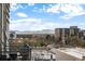 Expansive city view showcasing the skyline, mountains, and neighborhood from a private balcony at 1050 Cherokee St # 403, Denver, CO 80204