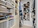 Organized walk-in closet with custom shelving, ample storage, and shoe racks at 1050 Cherokee St # 403, Denver, CO 80204