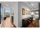 Hallway features hardwood floors, modern art, and industrial-style lighting at 1050 Cherokee St # 403, Denver, CO 80204