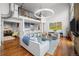 Open floor plan with a living room, kitchen, and view of the upper level at 1050 Cherokee St # 403, Denver, CO 80204