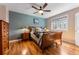 Cozy bedroom with wood flooring and built-in dresser at 2551 S Gilpin St, Denver, CO 80210