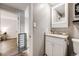 Bathroom vanity with granite countertops and stainless steel towel rack at 1349 Race St # 5, Denver, CO 80206