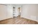 Bedroom featuring wood-look floors and a closet with storage shelving at 1349 Race St # 5, Denver, CO 80206