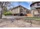 Multi-unit home features stone and wood trim accents and a covered parking area at 1349 Race St # 5, Denver, CO 80206
